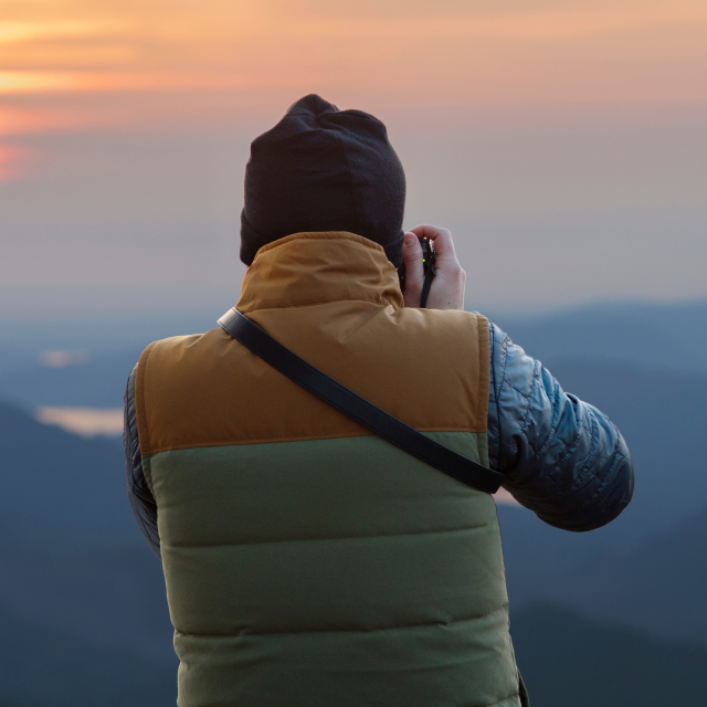 Photograph of Man holding Camera